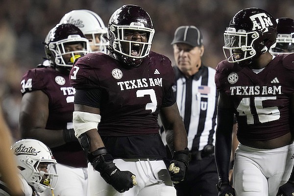 Texas A&M defensive lineman McKinnley Jackson (3) reacts after tackling Mississippi State quarterback Chris Parson during the first quarter of an NCAA college football game Saturday, Nov. 11, 2023, in College Station, Texas. (AP Photo/Sam Craft)