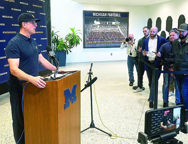Harbaugh says Moore will lead Michigan if judge doesnt rule in schools favor