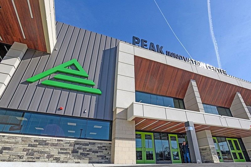 A man exits the Peak Innovation Center in Fort Smith in this March 28, 2022 file photo. The center is a multimillion-dollar hands-on learning facility offering state-of-the-art technical and career programming to high school students in 22 Northwest Arkansas school districts. (River Valley Democrat-Gazette/Hank Layton)