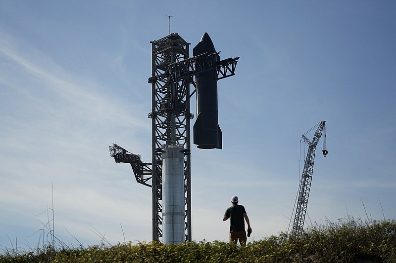 Onlookers watch as SpaceX’s mega rocket Starship is prepared for its upcoming launch from Starbase in Boca Chica, Texas, on Thursday.
(AP/Eric Gay)