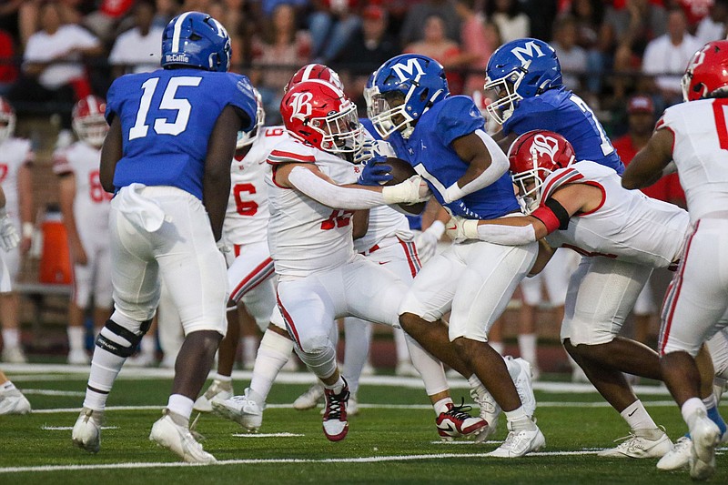 Staff photo by Olivia Ross / McCallie’s Javon McMahan (0) runs through Baylor defense. McCallie took on Baylor at home on Friday, September 29, 2023.