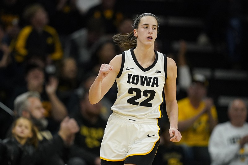 Iowa guard Caitlin Clark celebrates after making a 3-point basket during the first half of an NCAA college basketball game against Drake, Sunday, Nov. 19, 2023, in Iowa City, Iowa. (AP Photo/Charlie Neibergall)