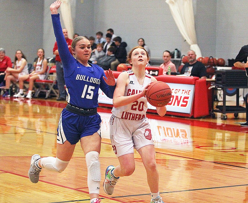 Calvary Lutheran’s Maddy Sprengel looks to take a shot past South Callaway’s McKenzie Laughlin during a game at Calvary Lutheran High School. (Greg Jackson/News Tribune)
