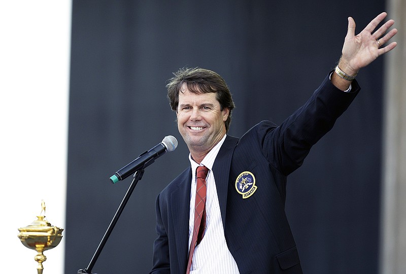 In this Sept 18, 2008, file photo, United States team captain Paul Azinger waves to spectators while speaking at the Ryder Cup opening ceremonies at the Valhalla Golf Club in Louisville, Ky. (Associated Press)