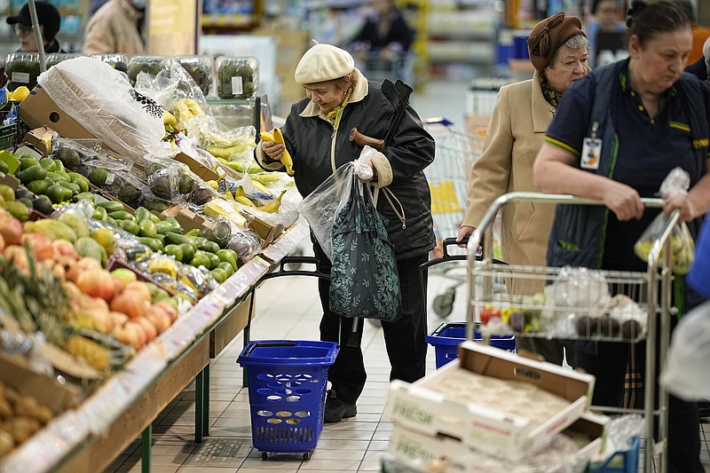 People buy fruits at a hypermarket in Moscow, Russia, in early November. (AP Photo)