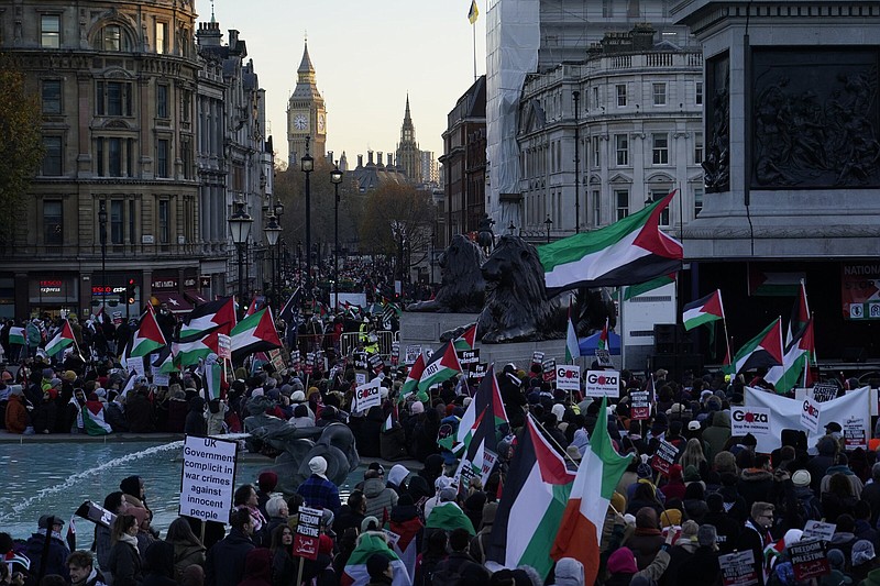 Protesters hold flags and placards on Saturday as they take part in a pro-Palestinian demonstration in Trafalgar Square in London.
(AP/Alberto Pezzali)
