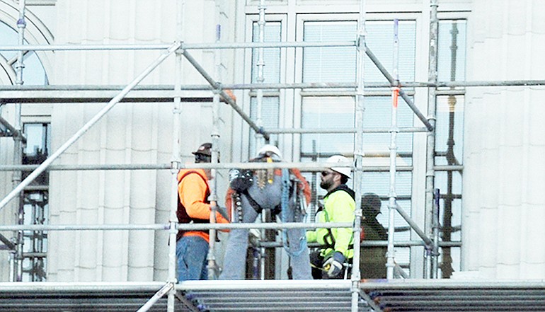 In this News Tribune file photo from Nov. 15, 2018, workers are seen on the scaffolding during a renovation project at the Missouri State Capitol.