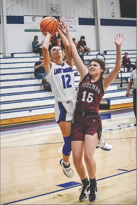 Southern Sass/Special to the News-Times

Taking aim: Parkers Chapel's Makenzie Morgan scores against Foreman. The Lady Trojans will play Centerpoint Wednesday at 4 p.m. at the Battle of the Cove Tournament in Magnet Cove.