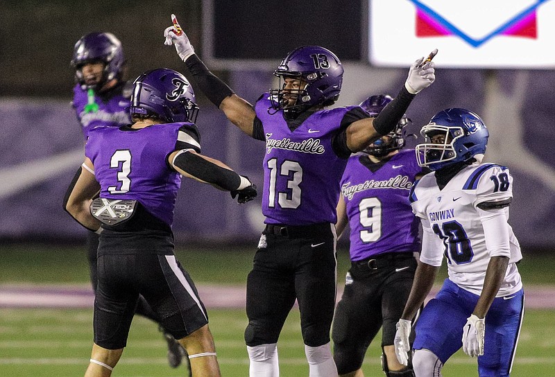 Fayetteville Bulldogs Senior Isaiah Taylor (13) celebrates breaking up a pass during the Conway at Fayetteville semifinal round state playoff football game at Harmon Field , November 24, 2023, Fayetteville, Arkansas (Special to NWA Democrat-Gazette/Brent Soule)
