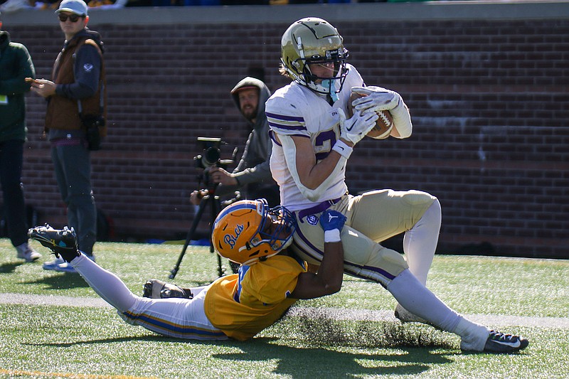Staff photo by Olivia Ross / Christ Presbyterian Academy's Owen Cabell carries the football into the end zone as Boyd Buchanan’s Isaac Summey  tries to bring him down during the TSSAA Division II-AA BlueCross Bowl on Thursday at Finley Stadium.