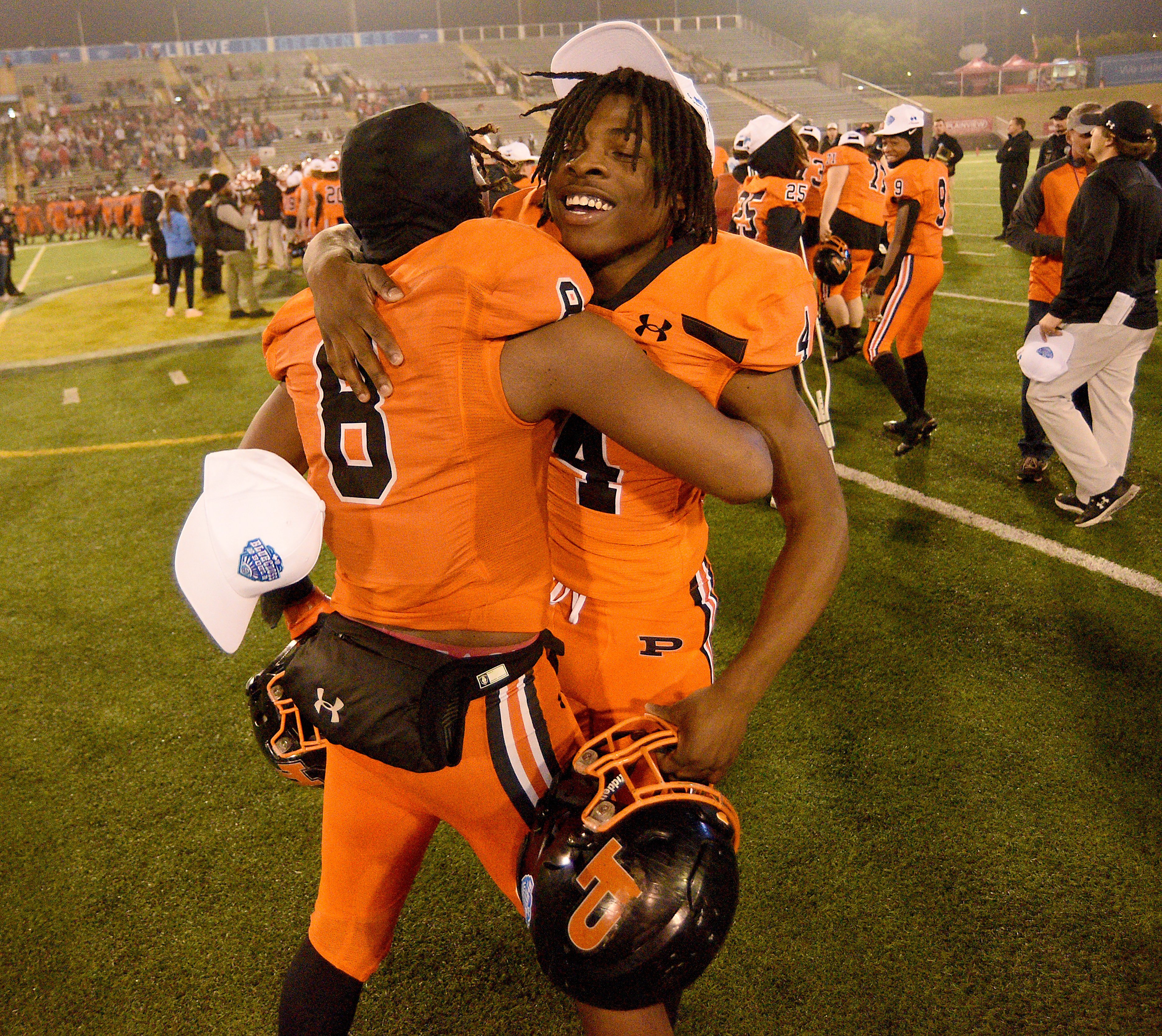 Staff photo by Matt Hamilton/ South Pittsburg's (8) Jamarion Farrior hugs (4) Kysaun Powell after winning the BlueCross Bowl Class 1A championship game at Finley Stadium on Friday, December 1, 2023.