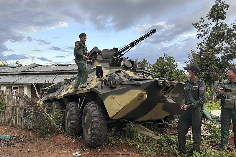 Members of an ethnic armed forces group, one of the three militias known as the Three Brotherhood Alliance, check an army armored vehicle the group allegedly seized from Myanmar’s army outpost on a hill in Hsenwi township in Shan state, Myanmar, last month.
(AP/The Kokang)