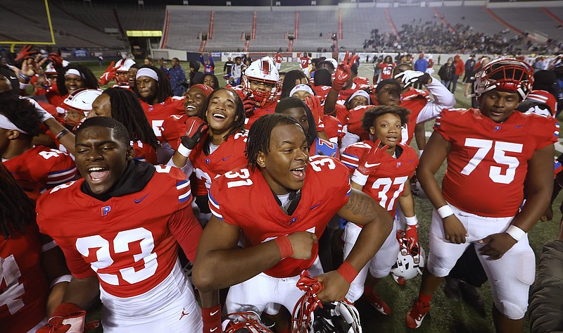 Little Rock Parkview players celebrate after the Patriots’ 55-12 win over Shiloh Christian in the Class 5A state Championship game on Saturday, Dec. 2, 2023, at War Memorial Stadium in Little Rock. .More photos at www.arkansasonline.com/123state5a/.(Arkansas Democrat-Gazette/Thomas Metthe)