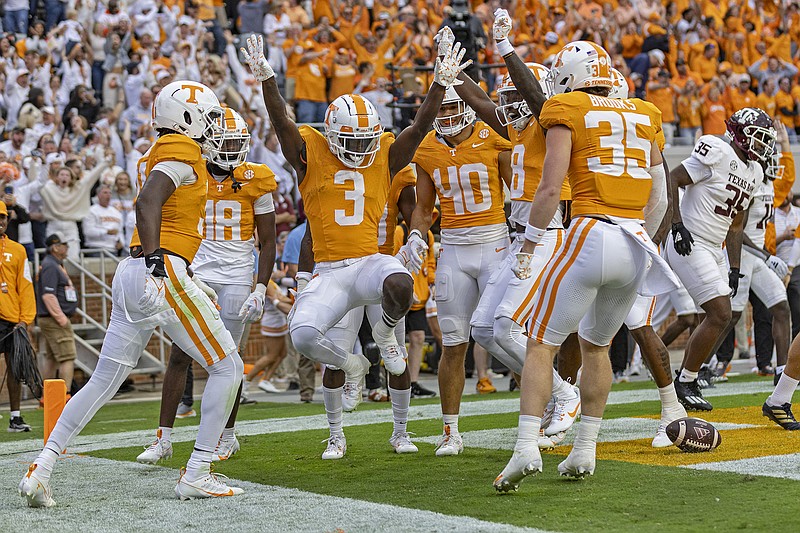 AP photo by Wade Payne / Tennessee's Dee Williams (3) celebrates with teammates after scoring a touchdown on a punt return during the Volunteers' home win against Texas A&M on Oct. 14. The Vols learned Sunday that they will face Iowa in the Citrus Bowl on New Year's Day in Orlando, Fla.