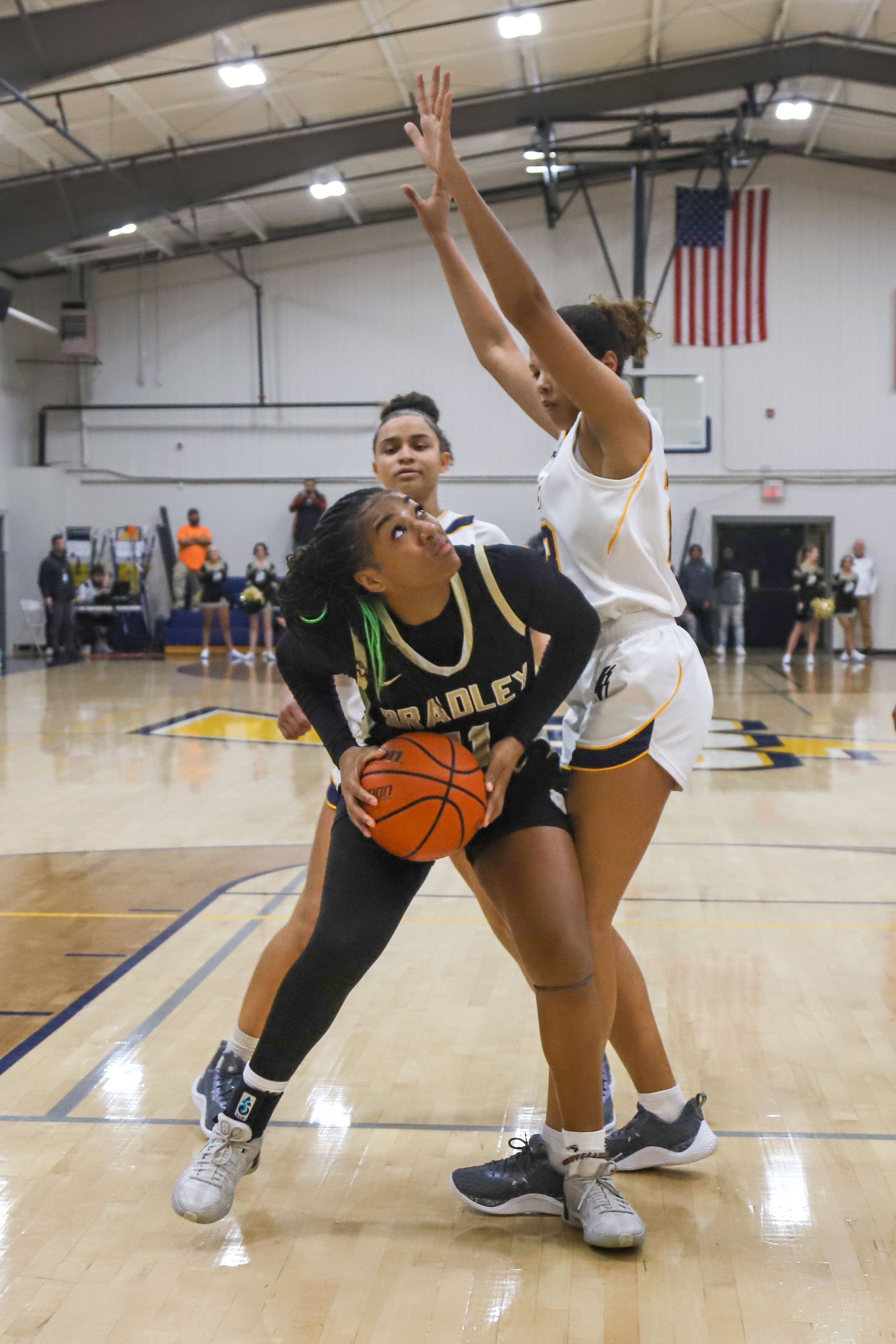 Staff photo by Olivia Ross / Bradley’s Harmonie Ware (11) looks to shoot, guarded by CCS’s Lailani Hatten (23). Chattanooga Christian took on Bradley Central at home on Tuesday, December 5, 2023.