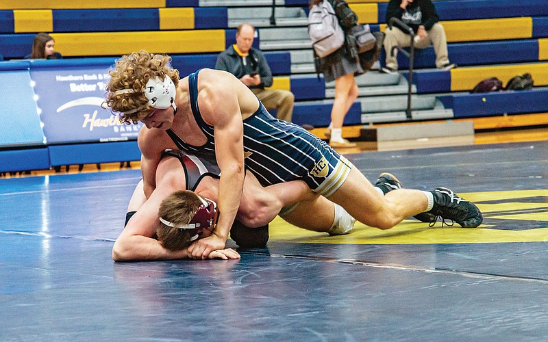 Ben Holee of Helias keeps School of the Osage's George Long on the mat during their match at 144 pounds in Tuesday night's dual at Rackers Fieldhouse. (Ken Barnes/News Tribune)