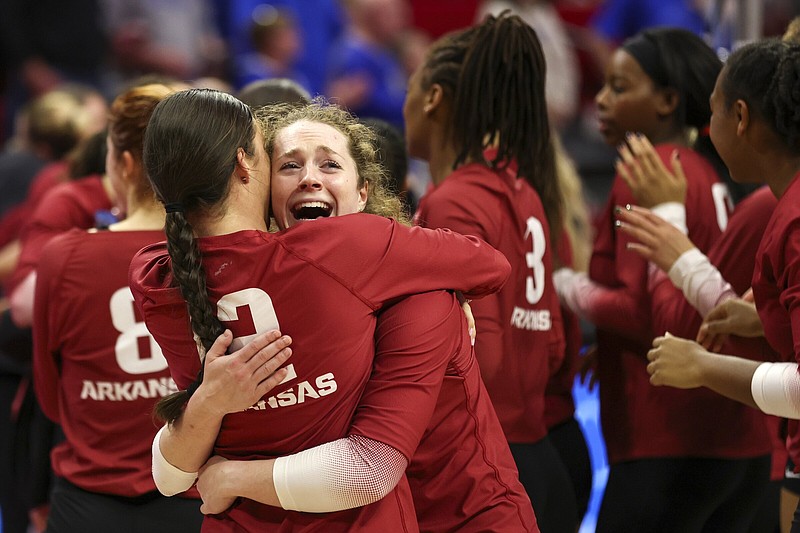 Arkansas’ Jill Gillen and Hailey Schneider (12) hug Thursday after the Razorbacks’ 3-2 victory over the Kentucky Wildcats in the regional semifinals of the NCAA Tournament at the Devaney Center in Lincoln, Neb. Arkansas advanced to face top overall seed Nebraska on Saturday in the regional final.
(AP/Omaha World-Herald/Nikos Frazier)