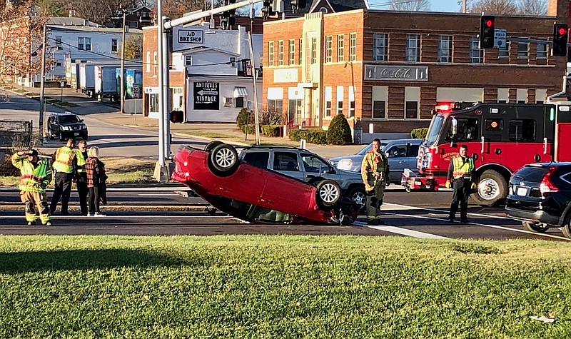 Joe Gamm/News Tribune photo: 
A car flipped onto its top after colliding with two other vehicles Thursday morning, Dec. 7, 2023, on westbound U.S. 50 near Jefferson Street in Jefferson City.