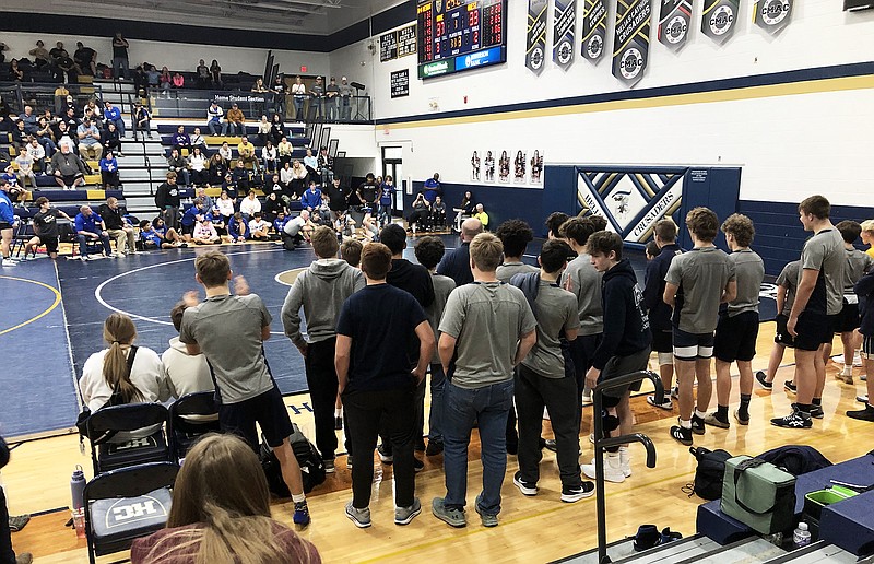 Helias team members watch from the edge of the mat during the final match of a dual against Capital City in the Missouri Duals at Rackers Fieldhouse. (Tom Rackers/News Tribune)