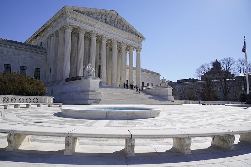 People stand on the steps of the U.S. Supreme Court in February 2022.
(AP/Mariam Zuhaib)