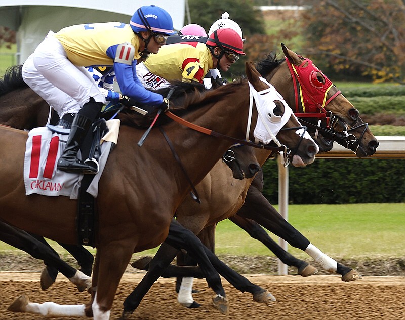 Thoroughbreds compete in a race earlier this month at Oaklawn Racing Casino and Resort in Hot Springs. Revenue from Oaklawn’s casino has led to increased purses at the track.
(Arkansas Democrat-Gazette/Thomas Metthe)