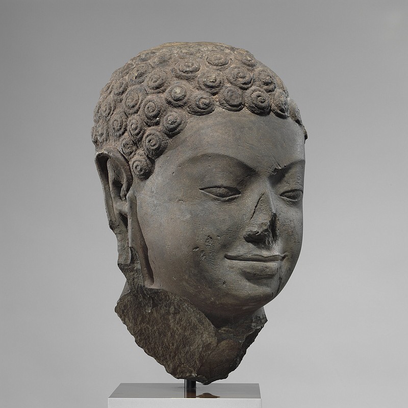 A seventh century sculpture titled “Head of Buddha” is shown at the Metropolitan Museum of Art in New York in a photo from December 2005.
(AP/Metropolitan Museum of Art)