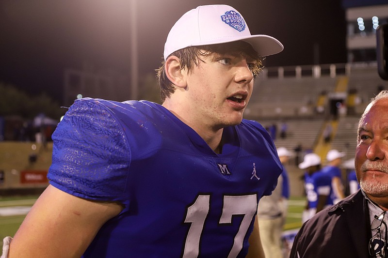 Staff photo by Olivia Ross / McCallie’s Carson Gentle (17) talks during an interview after their win against Baylor. Baylor took on McCallie on Thursday, November 30, 2023 in the BlueCross Bowl Division II-AAA state championship game at Finley Stadium.