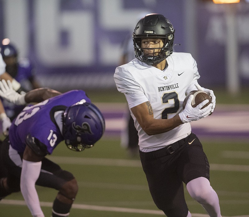 Bentonville’s C.J. Brown runs the ball against Fayetteville Friday Oct.13, 2023 at Harmon Field in Fayetteville.  Visit nwaonline.com/photo for today's photo gallery.   (NWA Democrat-Gazette/J.T. Wampler).