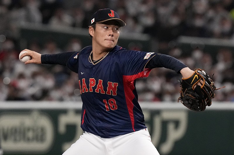Japanese right-hander Yoshinobu Yamamoto has agreed to terms with the Los Angeles Dodgers on a 12-year, $325-million deal, according to a report in the Los Angeles Times and other outlets.
(AP/Eugene Hoshiko)