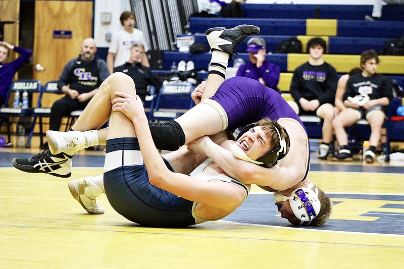 Charles Korba of Helias gets tangled up with Mason Todd of C.B.C. during their match at 132 pounds Thursday night at Rackers Fieldhouse. (Alexa Pfeiffer/News Tribune)