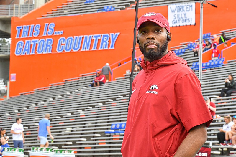 Arkansas interim offensive coordinator Kenny Guiton stands on the sideline, Saturday, Nov. 4, 2023, during warmups before a game against Florida at Ben Hill Griffin Stadium in Gainesville, Fla. Visit nwaonline.com/photo for today's photo gallery..(NWA Democrat-Gazette/Hank Layton)