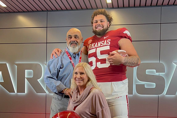 Arkansas offensive line signee Fernando Carmona and his parents during his official visit to Fayetteville earlier in December.