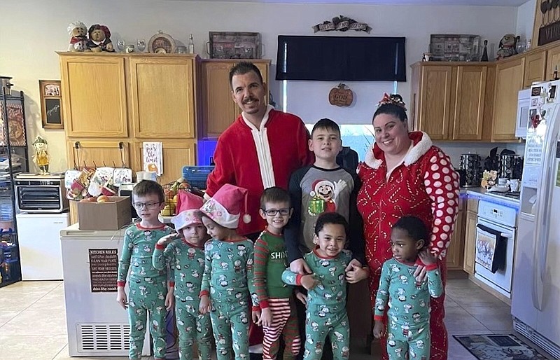 Karen Lopez and her husband, Jerry Lopez, are seen with their seven children in December.
(AP/Karen Lopez)