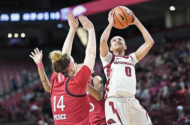 Arkansas guard Taliah Scott (0) shoots, Sunday, December 31, 2023 during the first half of a basketball game at Bud Walton Arena in Fayetteville. Visit nwaonline.com/photos for today's photo gallery...(NWA Democrat-Gazette/Charlie Kaijo)