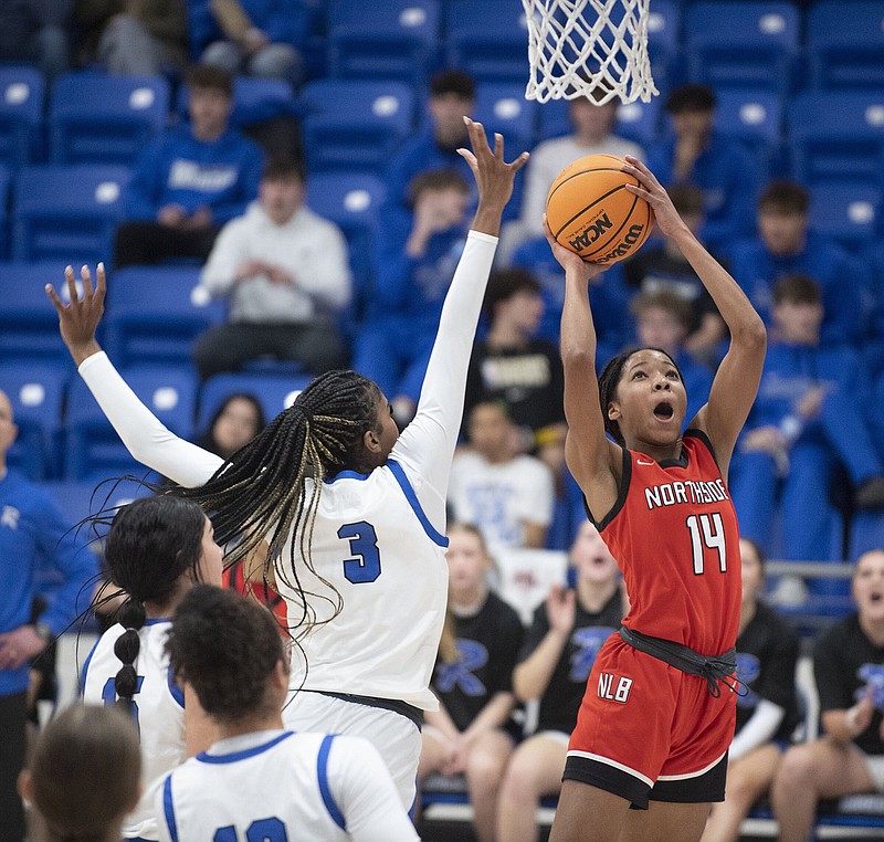 Fort Smith Northside’s Cherish Blackmon goes up for a shot under pressure from Rogers’ Brooklyn Owens Tuesday Jan. 2, 2024 at Mountie Arena in Rogers. Visit nwaonline.com/photo for today's photo gallery. (NWA Democrat-Gazette/J.T. Wampler).