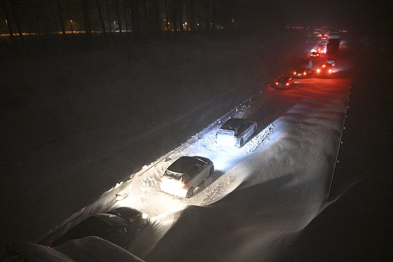Hundreds of vehicles are stuck Wednesday on the European route E22 at Ekeröd near Hörby in southern Sweden. More photos at arkansasonline.com/14euweather/.
(AP/TT News Agency/Johan Nilsson)