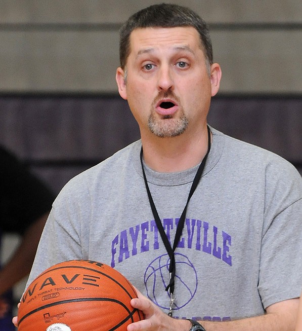Vic Rimmer, Fayetteville High School’s girl’s basketball coach, tells players the corrections they need to make when scrimmaging during practice at Fayetteville High School.
