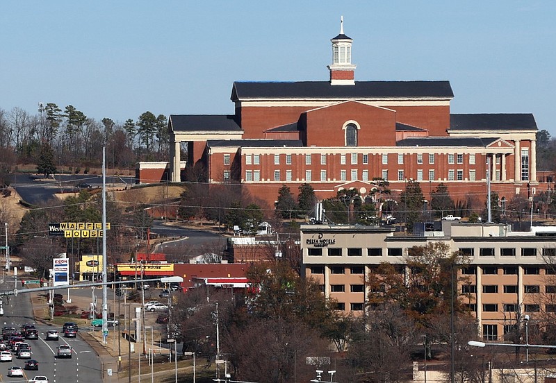 Immanuel Baptist Church, 501 N. Shackleford Road in Little Rock, looms over traffic and businesses near the intersection of Shackleford Road and Interstate 630 in this Dec. 19, 2023 file photo. (Arkansas Democrat-Gazette/Kyle McDaniel)