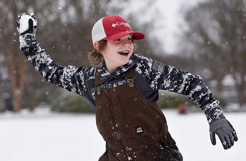Staff photo by Matt Hamilton/  Rome, Ga. resident Brantley Bryant, 11, throws a snowball while playing in Coolidge Park on Monday, January 15, 2024.