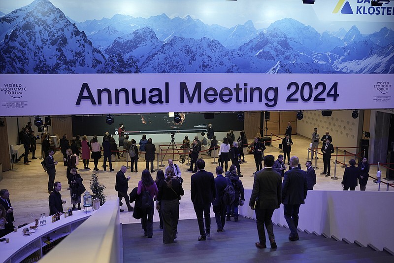 Participants walk through congress centre of the Annual Meeting of World Economic Forum in Davos, Switzerland, on Wednesday.
(AP/Markus Schreiber)