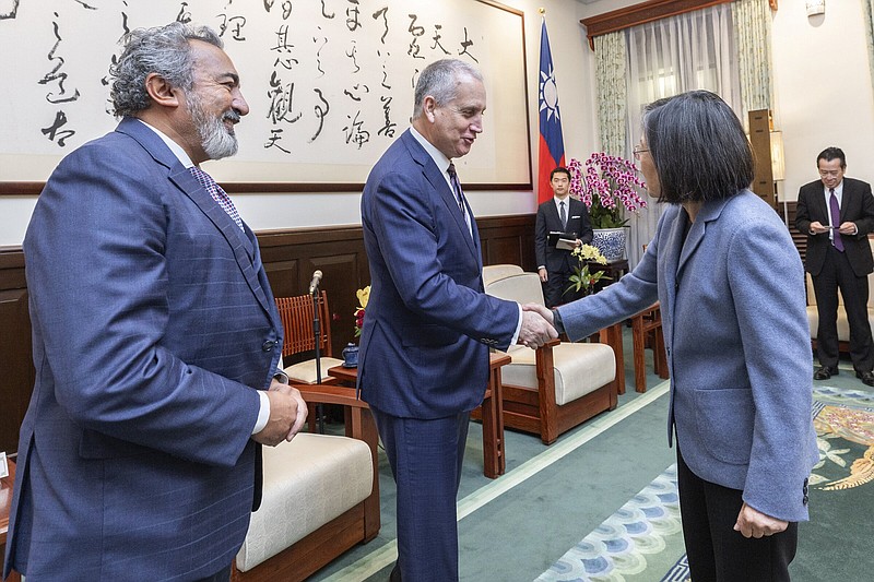 Taiwan’s President Tsai Ing-wen greets U.S. Rep. Mario Diaz-Balart, R-Fla., and Rep. Ami Bera, D-Calif., (left) in Taipei, Taiwan, on Thursday.
(AP/Taiwan Presidential Office)