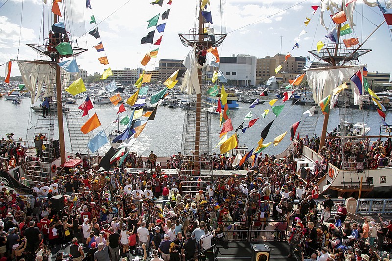 Hundreds of pirates cheer and toss beads aboard the Jose Gasparilla pirate ship before the start of the Gasparilla Invasion Parade on Saturday, Jan. 27, 2024, in Tampa. (Louis Santana/Tampa Bay Times via AP)