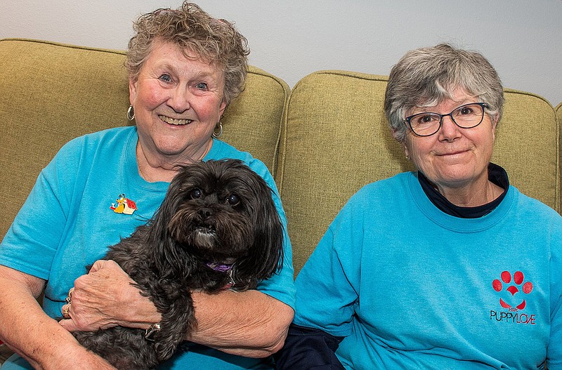 Patty Snipes (left) and her dog Molly are volunteers with the Humane Society of Pulaski County’s Puppy Love program, which was started by Dee Sadler (right).
(Arkansas Democrat-Gazette/Cary Jenkins)