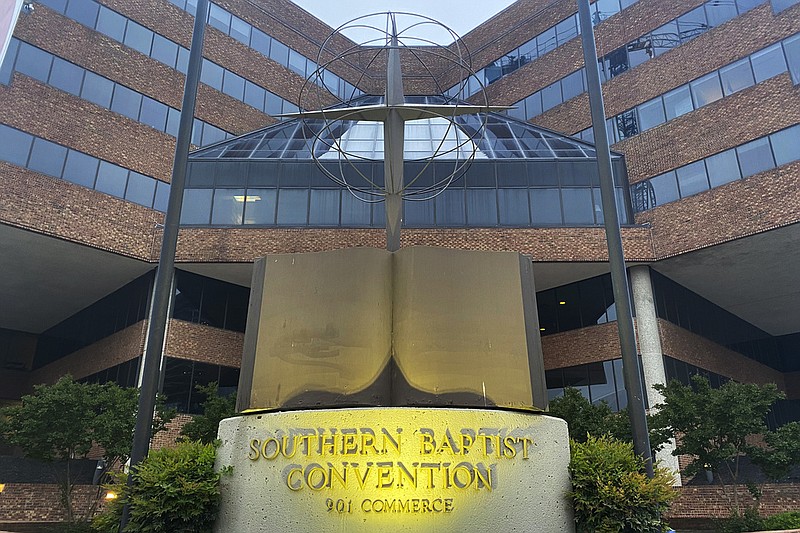 A cross and Bible sculpture stand outside the Southern Baptist Convention headquarters in Nashville, Tenn., in this May 24, 2022 file photo. (AP/Holly Meyer)