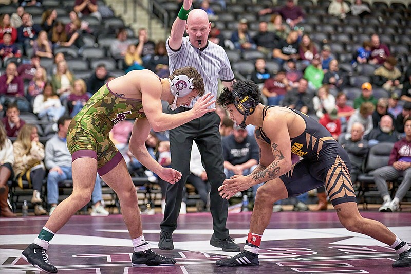 Kyle Dutton (left) and the No. 20 University of Arkansas-Little Rock wrestling team face what Coach Neil Erisman called their toughest conference matchup when they take on No. 23 Cal Poly-San Luis Obispo today at the Jack Stephens Center in Little Rock.
(UALR Athletics/Mark Wagner)