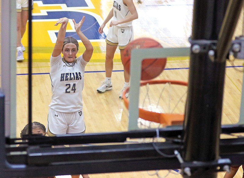Claire Morris of Helias watches her free throw go through the basket during Saturday's game against Hazelwood East in the Central Bank Shootout at Rackers Fieldhouse. (Jason Strickland/News Tribune)
