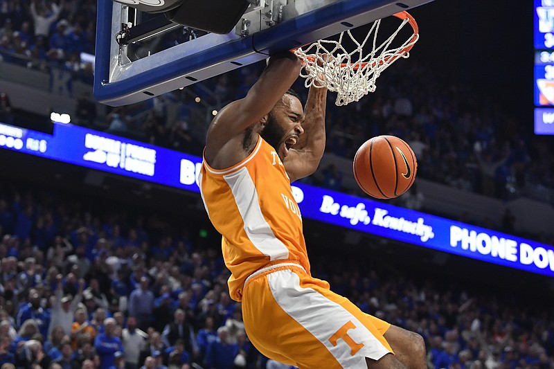 Tennessee guard Josiah-Jordan James (30) scores during the first half of an NCAA college basketball game against Kentucky in Lexington, Ky., Saturday, Feb. 3, 2024. Tennessee won 103-92. (AP Photo/Timothy D. Easley)