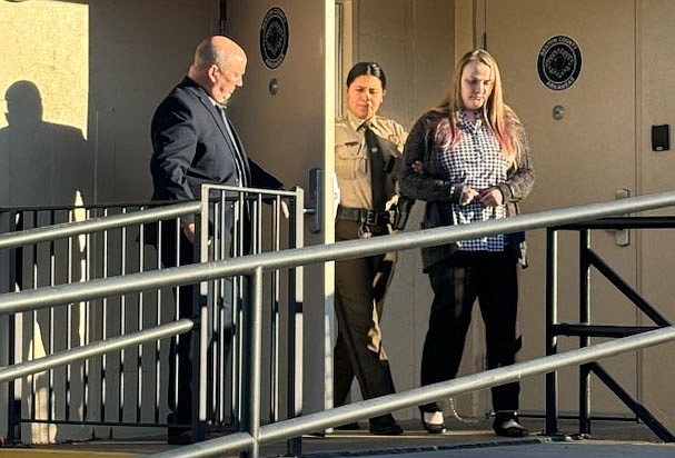 Shawna Cash (right) leaves court Monday, Feb. 5, 2024, after the first day of her capital murder trial in Bentonville..(NWA Democrat-Gazette/Tracy Neal)