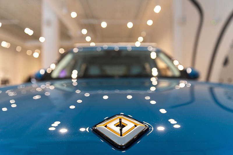 A Rivian R1T truck is seen at a media event marking the opening of the company's new showroom at Ponce City Market in Atlanta on Thursday, Oct. 19, 2023. (Arvin Temkar/The Atlanta Journal-Constitution/TNS)
