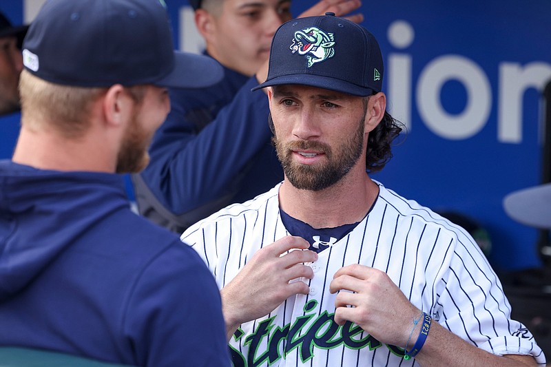 Gwinnett Stripers infielder Charlie Culberson talks with pitcher Michael Soroka before their game against the Jacksonville Jumbo Shrimp for the Stripers season opener at Coolray Field, Friday, March 31, 2023, in Lawrenceville, Ga. Jason Getz / Jason.Getz@ajc.com)
